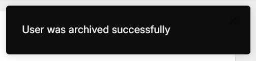 Black rectangular pop-up notification with the text "User was archived successfully".